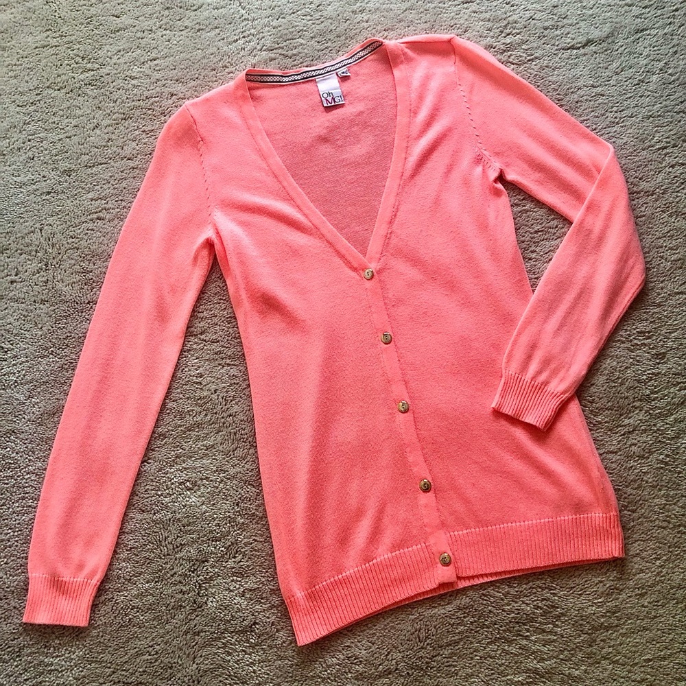 Peachy colored cardigan